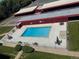 Aerial view of a community pool with clear blue water surrounded by seating and well-maintained landscaping at 7801 W 35Th Ave # 1, Wheat Ridge, CO 80033