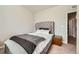 This bedroom features a comfortable bed with tufted headboard and side tables at 2311 Horse Shoe Cir, Fort Lupton, CO 80621