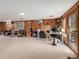 Versatile basement space with natural light, wood-paneled walls, ideal for an office and play area at 7105 Dover Way, Arvada, CO 80004