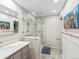 Clean bathroom featuring a glass shower, modern fixtures, and sleek vanity at 7105 Dover Way, Arvada, CO 80004