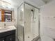 Modern bathroom featuring a glass-enclosed shower and a sleek vanity, offering a clean aesthetic at 7105 Dover Way, Arvada, CO 80004