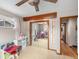 Bright bedroom with hardwood floors, neutral walls, and mirrored closet at 7105 Dover Way, Arvada, CO 80004