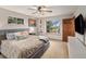 Calm bedroom with a large bed, windows, and natural light at 7105 Dover Way, Arvada, CO 80004