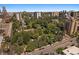 Scenic aerial view of the neighborhood with tree-lined streets, city park, and Denver skyline at 422 E 6Th Ave, Denver, CO 80203