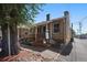 Charming brick duplex with covered porch and 'Coming Soon' signage, nestled near mature trees at 422 E 6Th Ave, Denver, CO 80203