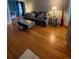 Comfortable living room with hardwood floors, stylish coffee table, and cozy seating arrangement at 422 E 6Th Ave, Denver, CO 80203