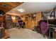 Finished basement with wood paneled walls, a drop ceiling, carpeting, and plenty of space for entertainment at 3506 S Depew St # 3, Denver, CO 80235