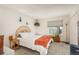 Cozy bedroom with ample natural light, neutral colors, and closet space at 3506 S Depew St # 3, Denver, CO 80235