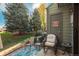 Cozy outdoor patio with comfortable seating and views of mature trees at 3506 S Depew St # 3, Denver, CO 80235