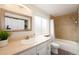Clean bathroom, featuring a bathtub, shower, and updated vanity at 4632 S Pagosa Cir, Aurora, CO 80015