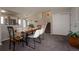 Bright dining area with a wooden table and four chairs at 4632 S Pagosa Cir, Aurora, CO 80015