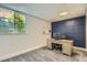 Finished basement office space featuring a large window and natural lighting at 10155 Silver Maple Cir, Highlands Ranch, CO 80129