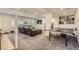 Spacious finished basement with a ping pong table and a comfortable seating area at 10155 Silver Maple Cir, Highlands Ranch, CO 80129