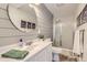 Modern bathroom featuring a stand-up shower and sleek vanity with ample storage space at 10155 Silver Maple Cir, Highlands Ranch, CO 80129
