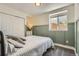 Cozy bedroom with large window, stylish accents, and a spacious closet at 10155 Silver Maple Cir, Highlands Ranch, CO 80129