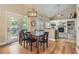 Open dining area with access to outdoor balcony and views into the living room at 10155 Silver Maple Cir, Highlands Ranch, CO 80129