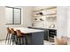 Home bar area with sleek countertops, floating shelves, a wine fridge, and bar stool seating at 732 S Gaylord St, Denver, CO 80209