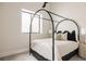 Serene bedroom with a canopy bed, soft lighting, and a calm atmosphere for relaxation at 732 S Gaylord St, Denver, CO 80209