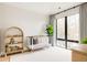 Light-filled Bedroom with a crib, hardwood floors, and abundant natural light at 732 S Gaylord St, Denver, CO 80209