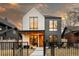 Striking modern home featuring white brick and gray siding, complemented by a well-manicured front yard at 732 S Gaylord St, Denver, CO 80209
