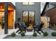 Charming front patio with a cozy fire pit and comfortable seating, perfect for outdoor gatherings at 732 S Gaylord St, Denver, CO 80209