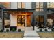 Inviting front porch with stylish seating and a view into the home's modern interior design at 732 S Gaylord St, Denver, CO 80209