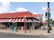Classic Bonnie Brae Ice Cream shop with a red and white striped awning and a retro sign at 732 S Gaylord St, Denver, CO 80209