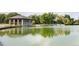 Scenic lake view with a lakeside building surrounded by lush greenery at 732 S Gaylord St, Denver, CO 80209