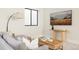Comfortable living room space featuring stylish furnishings, a cozy sofa, and a modern aesthetic at 732 S Gaylord St, Denver, CO 80209