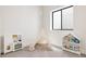 Charming playroom featuring a toy kitchen, tent, and bookshelf, perfect for creative play and learning at 732 S Gaylord St, Denver, CO 80209