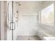 Contemporary glass-enclosed shower with seating and convenient shower head at 732 S Gaylord St, Denver, CO 80209