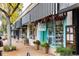 Charming boutique with colorful planters and window displays, framed by a striped awning at 732 S Gaylord St, Denver, CO 80209