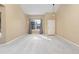 Bright living room with new carpet, freshly painted walls, and a view of the front yard at 3931 Shane Valley Trl, Castle Rock, CO 80109