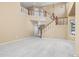 Beautiful living room with staircase featuring a decorative chandelier, and large windows at 3931 Shane Valley Trl, Castle Rock, CO 80109