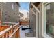 Snowy backyard with wooden fence and patio furniture at 6727 Canosa St, Denver, CO 80221