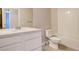 Clean bathroom with white vanity, toilet and bathtub at 6727 Canosa St, Denver, CO 80221