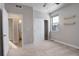 Bright bedroom featuring carpet and a sliding door closet at 6727 Canosa St, Denver, CO 80221