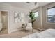 Serene bedroom sitting area with a comfy chair and artwork at 6727 Canosa St, Denver, CO 80221