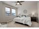 Spacious bedroom with a king-size bed and large windows at 6727 Canosa St, Denver, CO 80221