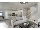 Open concept living room with kitchen and staircase visible at 6727 Canosa St, Denver, CO 80221