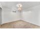 Finished basement with carpet flooring, white walls, and a window for natural light at 588 Empire St, Aurora, CO 80010