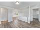 Well-lit living room showcases wood-look floors, white trim, and an open layout with access to other rooms at 588 Empire St, Aurora, CO 80010