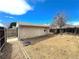 View of the backyard with a detached garage and fence at 6725 W 55Th Ave, Arvada, CO 80002