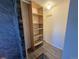 Walk-in closet featuring built-in shelves and hanging rod for organized storage at 6725 W 55Th Ave, Arvada, CO 80002