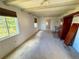 Bright living room featuring exposed beams, two windows and carpeted flooring at 6725 W 55Th Ave, Arvada, CO 80002