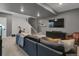 Finished basement featuring modern gray couches, a large TV, and recessed lights at 221 Felicity Loop, Castle Rock, CO 80109