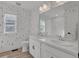 Bathroom featuring a double sink, a large mirror, and a window, with bright accent colors at 221 Felicity Loop, Castle Rock, CO 80109