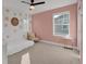 Bright bedroom with a ceiling fan, a side table, and a comfortable chair at 221 Felicity Loop, Castle Rock, CO 80109