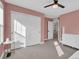 Bedroom featuring a fan, a closet with sliding doors and a dresser in the corner at 221 Felicity Loop, Castle Rock, CO 80109