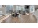 Sun-drenched living room with hardwood floors, fireplace, and large windows at 221 Felicity Loop, Castle Rock, CO 80109